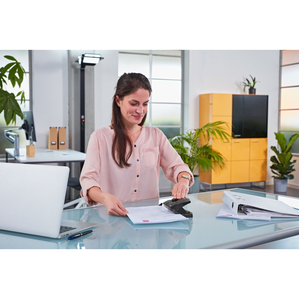 office worker, desk, documents, stapler, laptop